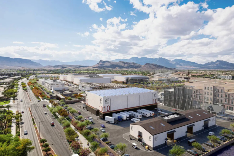 A rendered image of the proposed Summerlin Production Studios in Las Vegas, showcasing multiple soundstages, backlots, and production facilities with a scenic mountain backdrop and nearby residential areas.